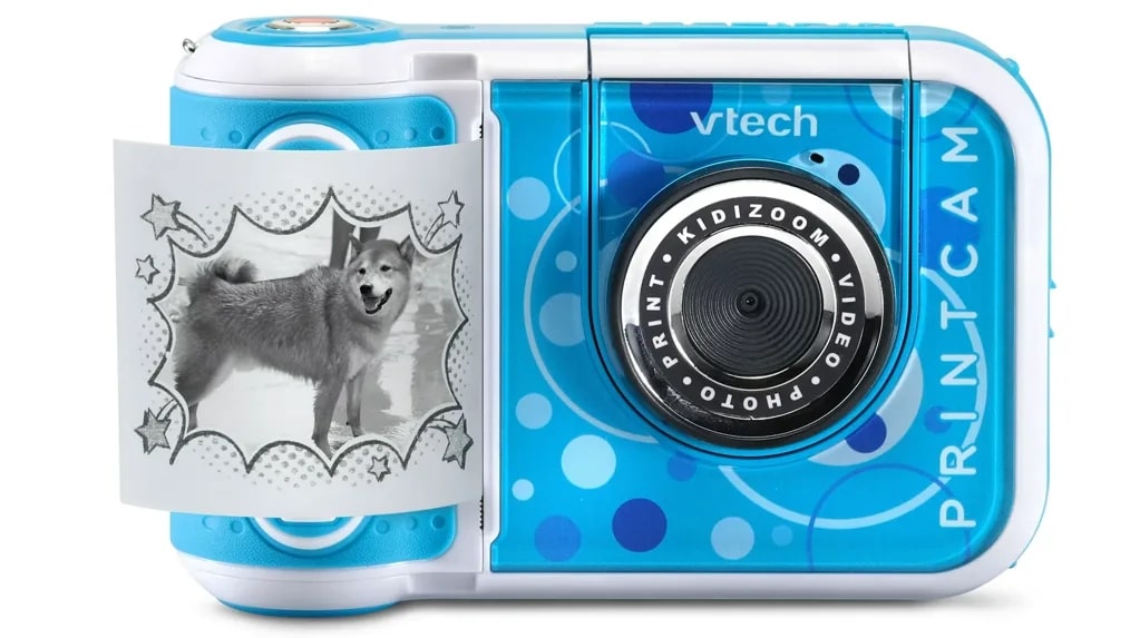 VTech KidiZoom PrintCam blå digitalkamera med utskrift av foto på en hund.