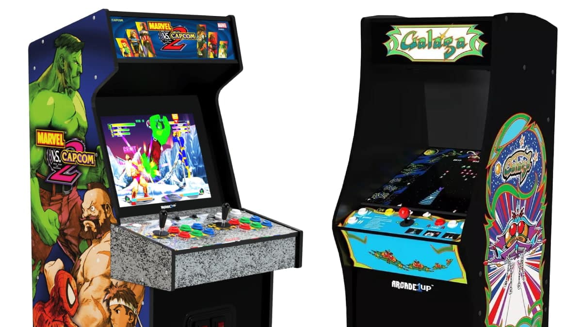 Two arcade machines side by side: one featuring "Marvel vs. Capcom 2" with colorful graphics, the other displaying "Galaga" artwork.