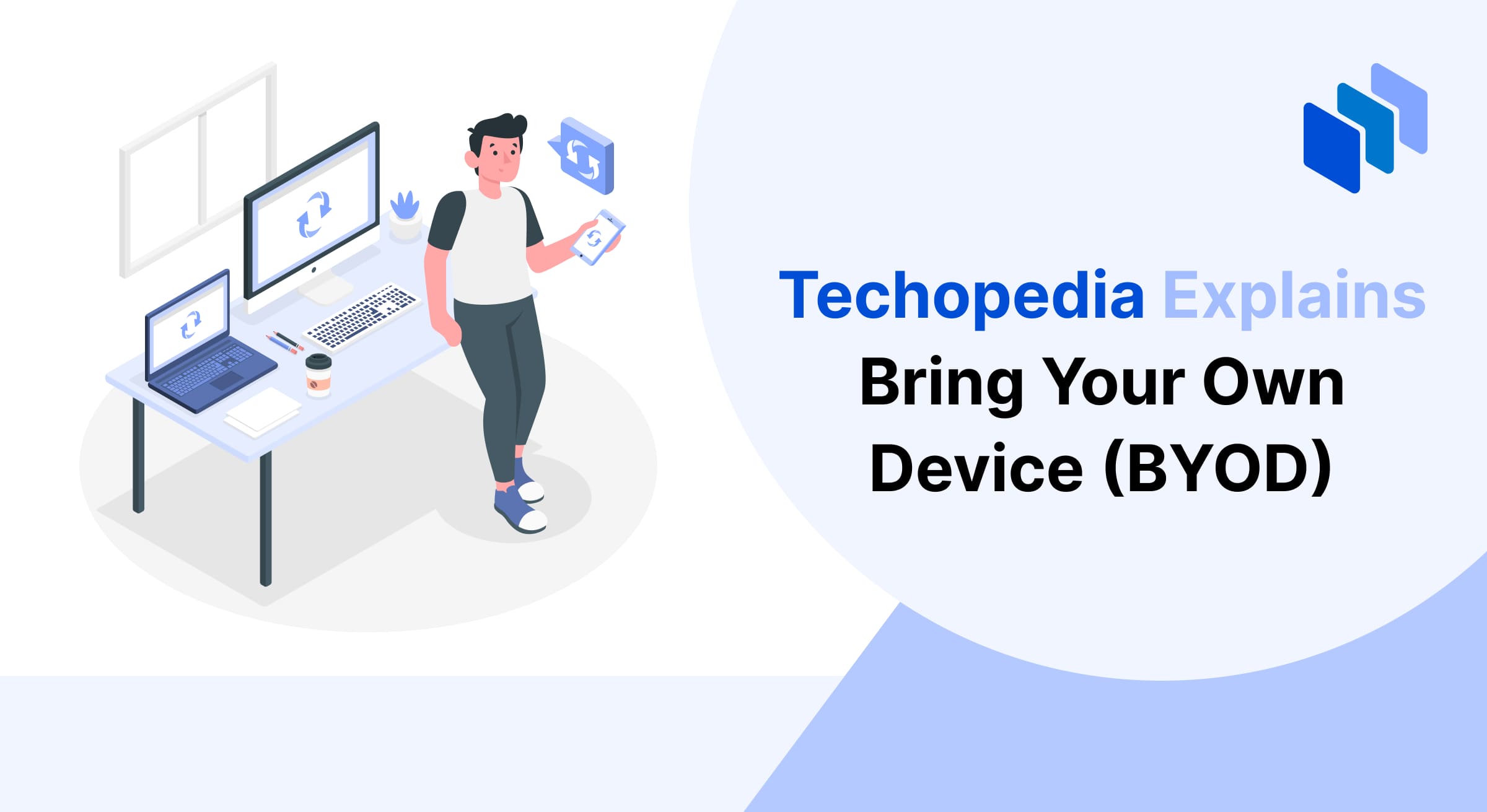 An individual holding a smartphone, standing near a desk with various devices, symbolizing the concept of Bring Your Own Device (BYOD).