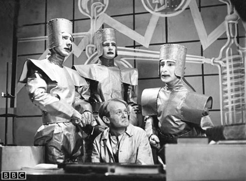 This image is from a 1938 BBC television production of Karel Čapek’s play “R.U.R.” (Rossum’s Universal Robots). The play is notable for introducing the word “robot” to the world and explores themes of artificial intelligence, automation, and humanity. This production is one of the earliest adaptations of the play for television.
