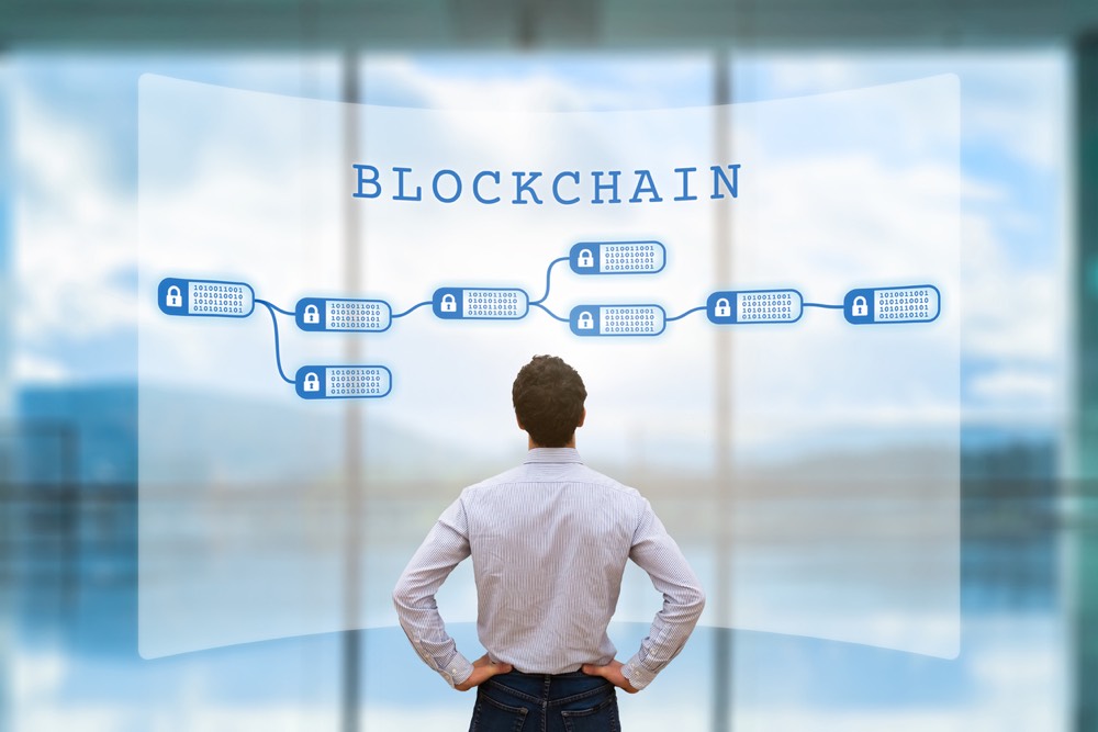 Person looking at blockchain concept on screen