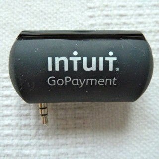 Intuit GoPayment credit card payment device on white cloth background