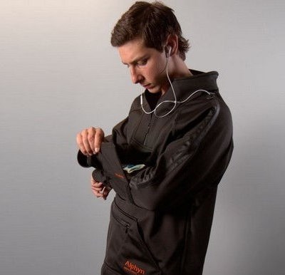 man wearing Wearcom SOMA-1 pullover and using phone in sleeve compartment