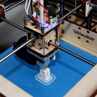 Ultimaker 3D printer printing a white object