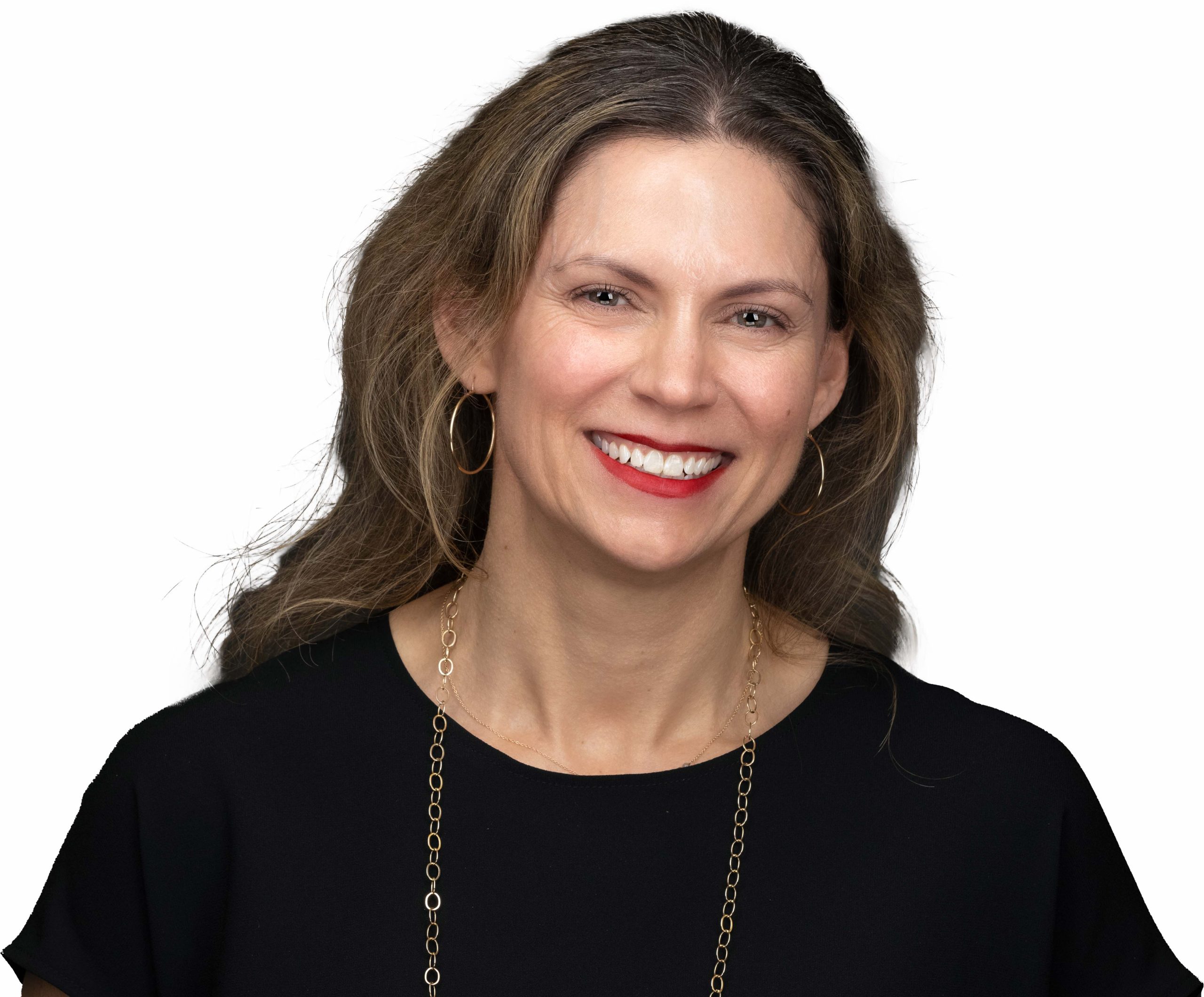 Susan Stone smiles facing directly toward the camera with her head tilted slightly toward the left. She is wearing a black boat-neck blouse with a gold chain necklace, gold hoop earrings and red lipstick.