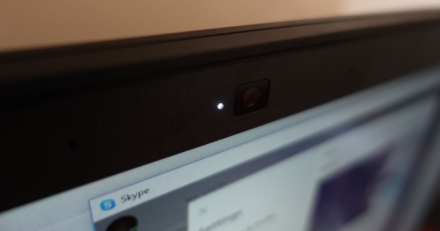 white webcam indicator light next to lens