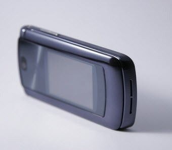 slim gray flip phone standing on its side