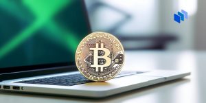 A bitcoin on a laptop
