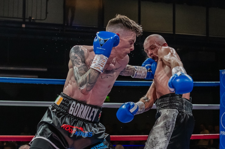 Lee Gormley is hitting his opponent in the ring
