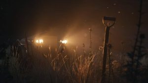 A shovel stuck in the dirt lit by headlights is never something you want to see.