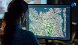 A woman looking at a map on a computer screen