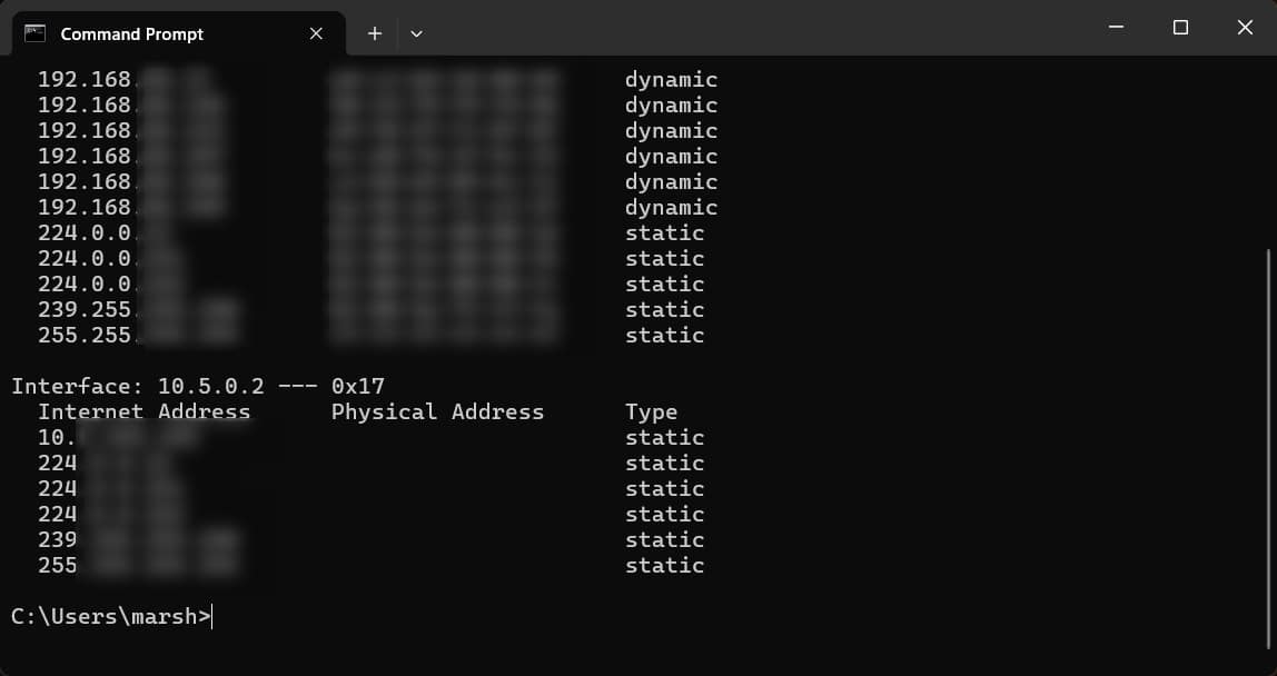 A screenshot of the Command Prompt displaying a list of network devices identified through the arp -a command. It shows IP addresses, MAC addresses, and whether the addresses are dynamically or statically assigned.
