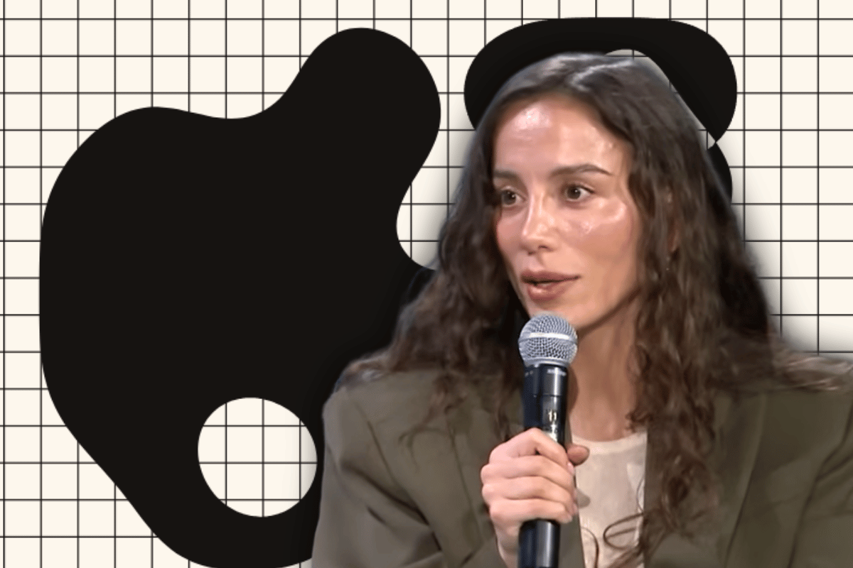 Thinking Machines Lab founder Mira Murati speaks in front of Inkling branding following the launch of the startup's first open-weights AI model.