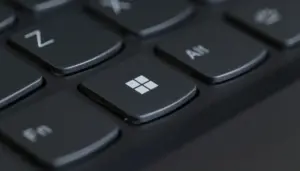 Close-up of a laptop keyboard with the Windows key in focus.